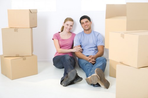 Professional movers loading furniture for a local house move