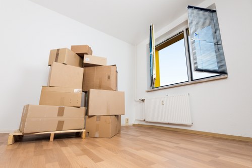 Organised office boxes and equipment ready for transport