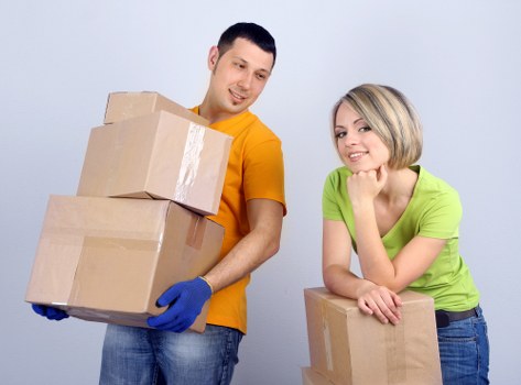 Local moving team unloading belongings at a new home
