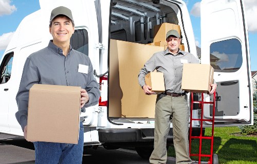 Professional movers handling furniture access on a residential street in Bickley
